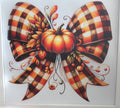 Fall colored bow with pumpkin.