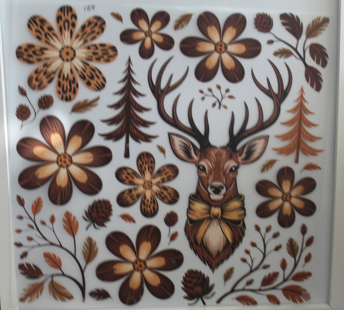 Deer with flowers and trees.