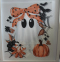Cute ghost with orange bow and pumpkin and spider web.