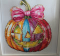 Multi colored Pumpkin with pink bow