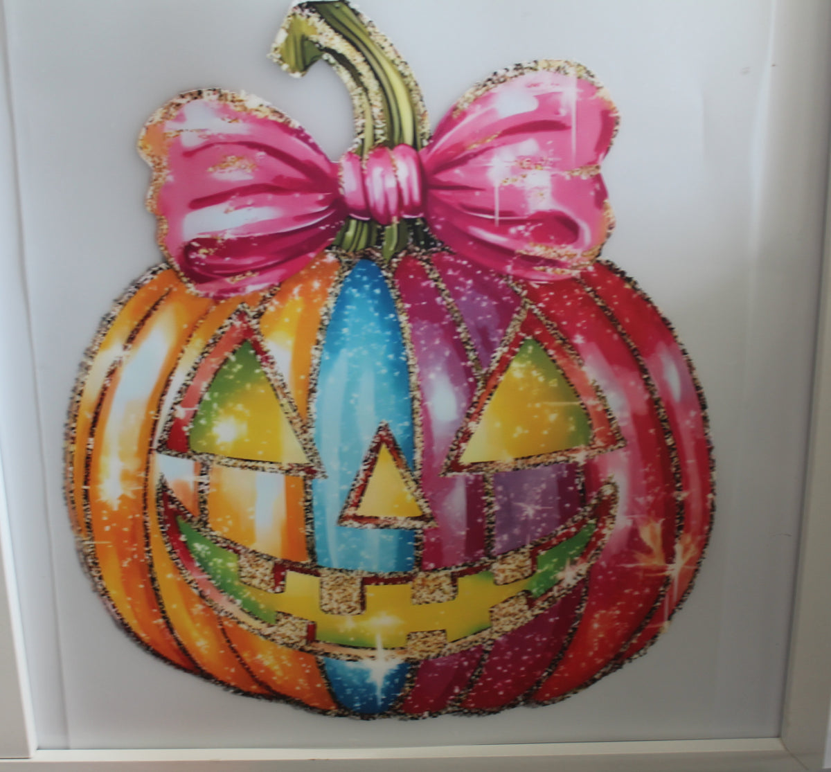 Multi colored Pumpkin with pink bow