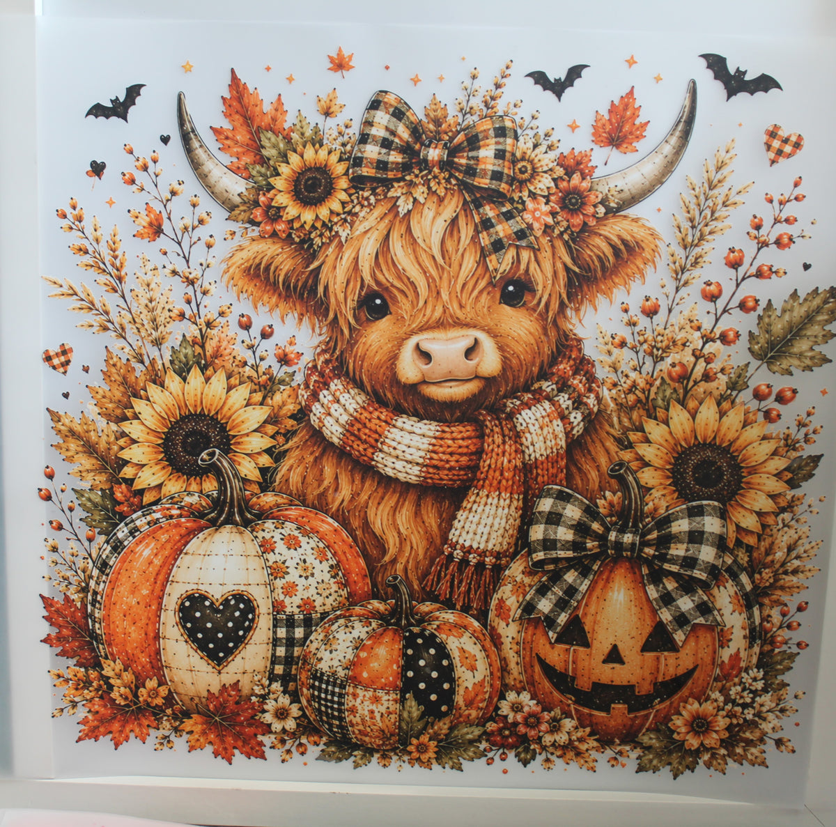 Cow with pumpkins and fall flowers